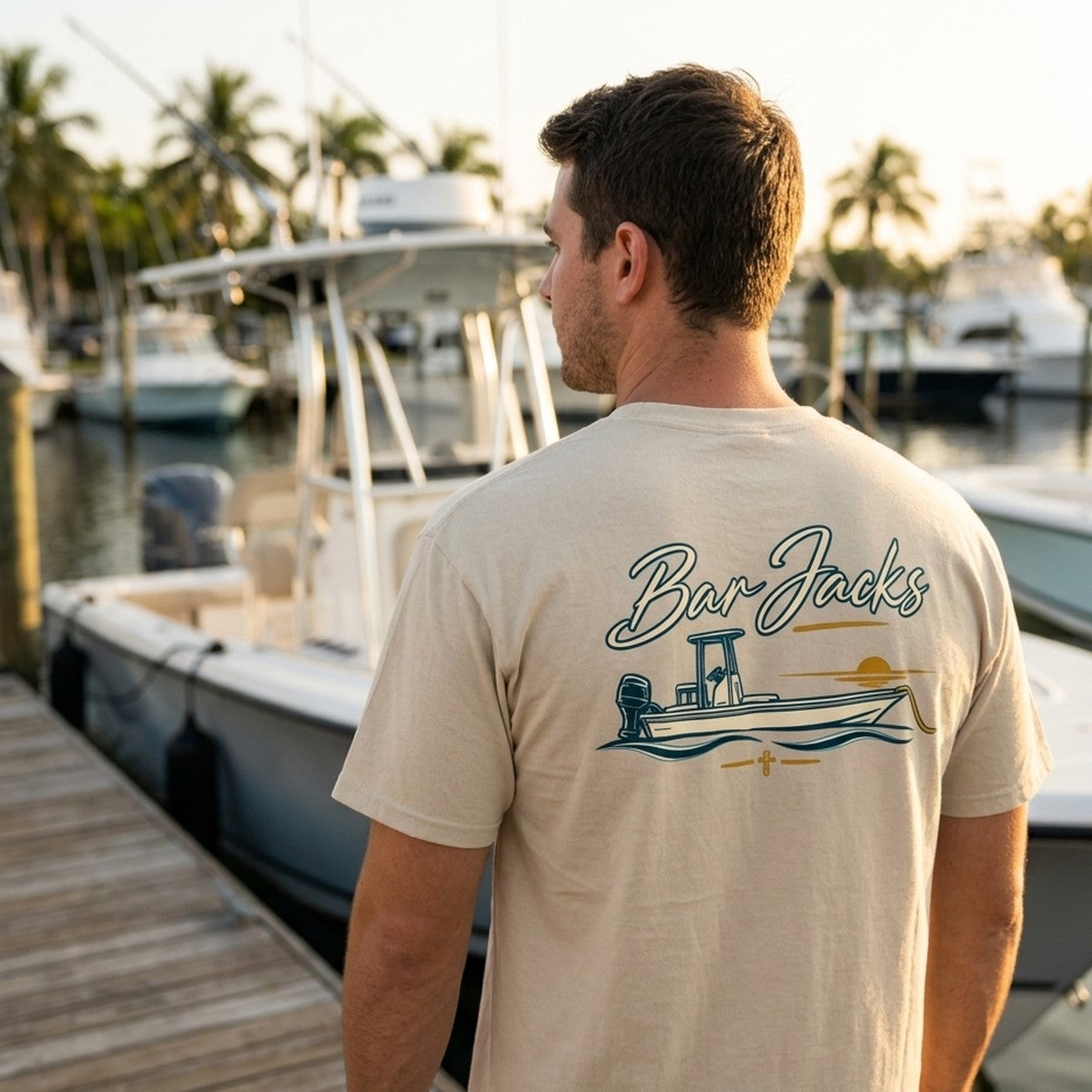 Bar Jacks Faith Collection - Center Console Sunset tee on a marina dock